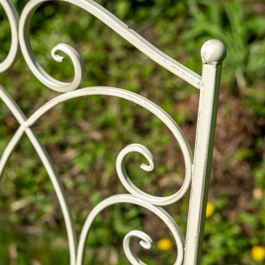 Close-up of a cream-coloured chair from the Cheltenham 5-piece bistro set.