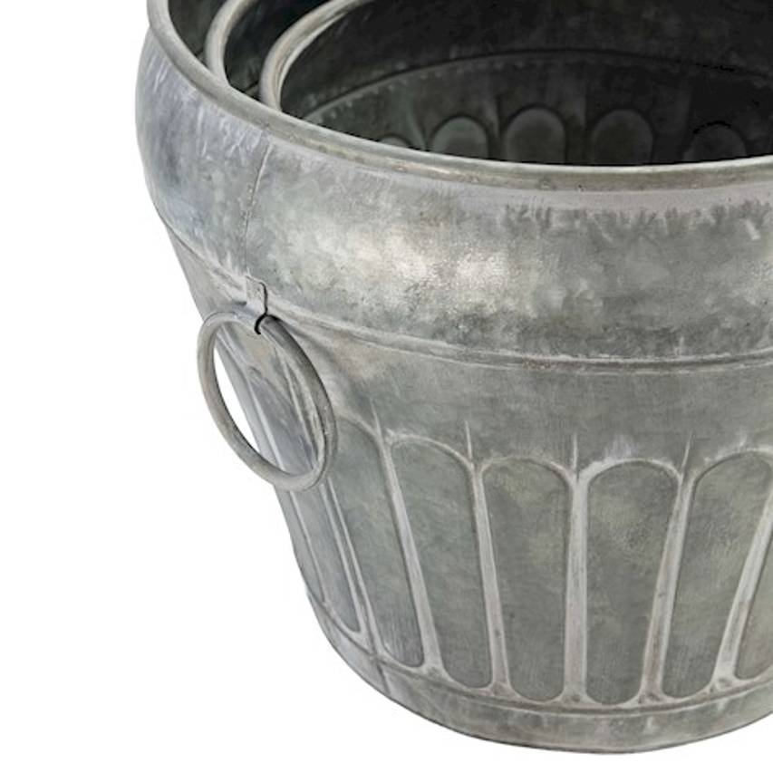 Close up of urn planter in antique galvanised steel