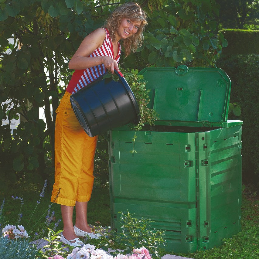 Green Thermo-King composter (400 litres) being filled with garden waste