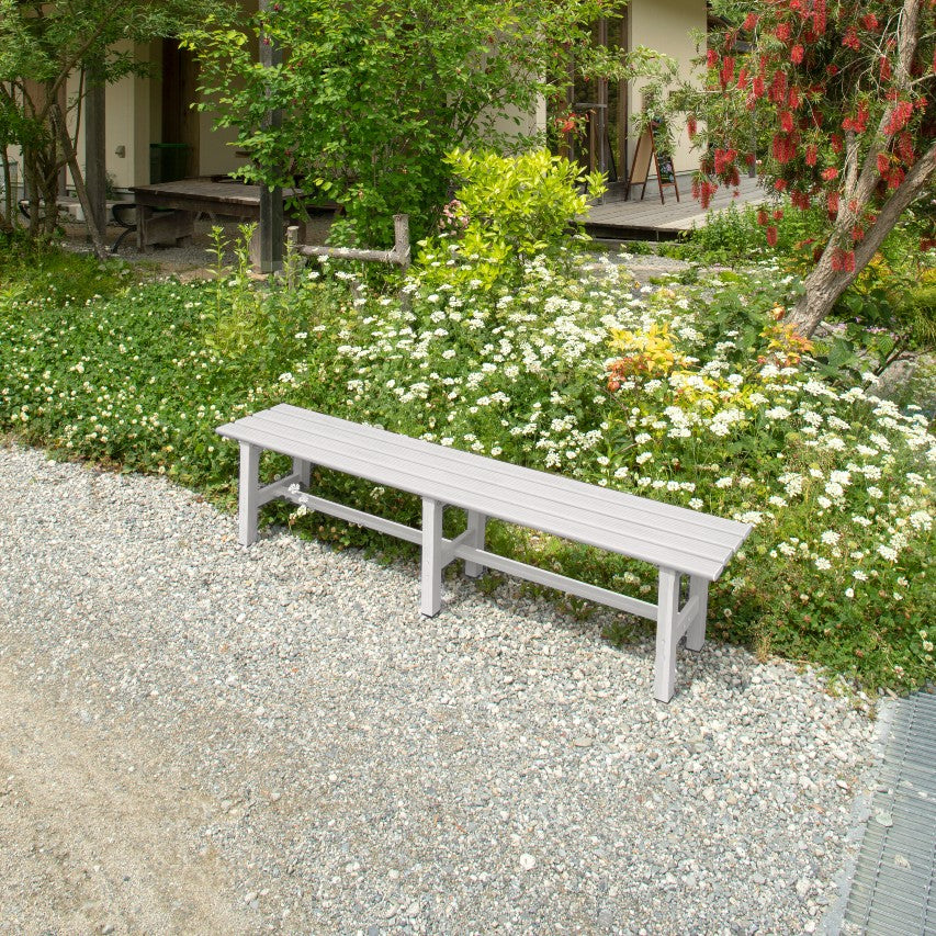 VegTrug aluminium bench powder coated grey on gravel path next to flower border